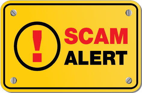 Yellow sign with "Scam Alert" printed on it.