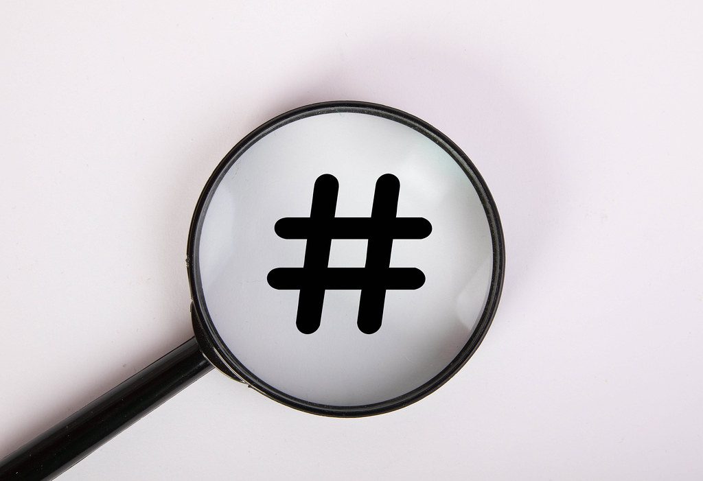 Hashtag under magnifying glass