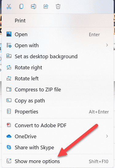 The Windows 11 right-click menu with an arrow pointing to "Show more options."